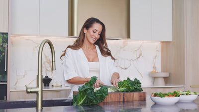 Lifestyle video with no sound, showing The Cooper Method founder Yasemin Cooper performing pilates movements and cooking nutritious meals